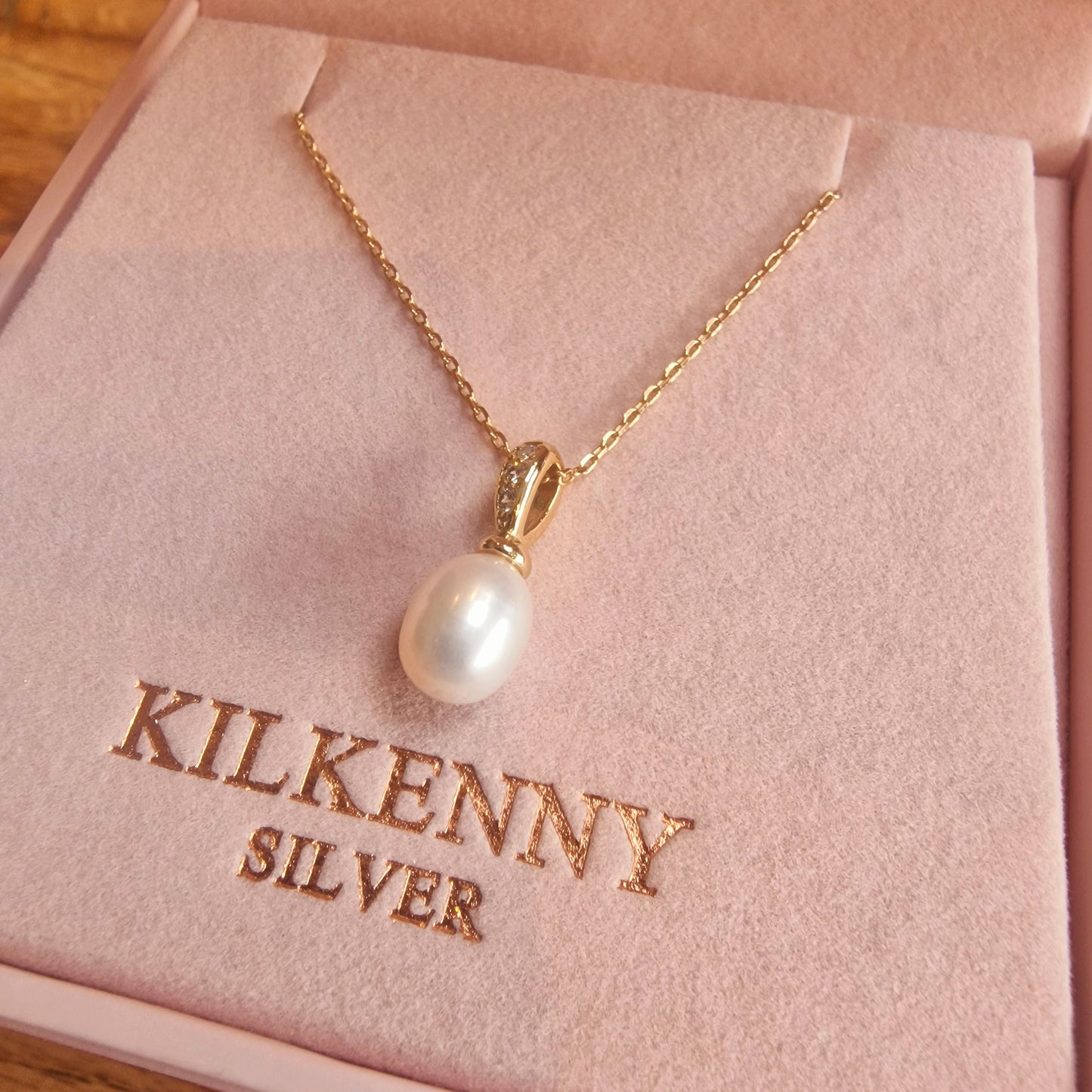 Gold pearl drop necklace with stones