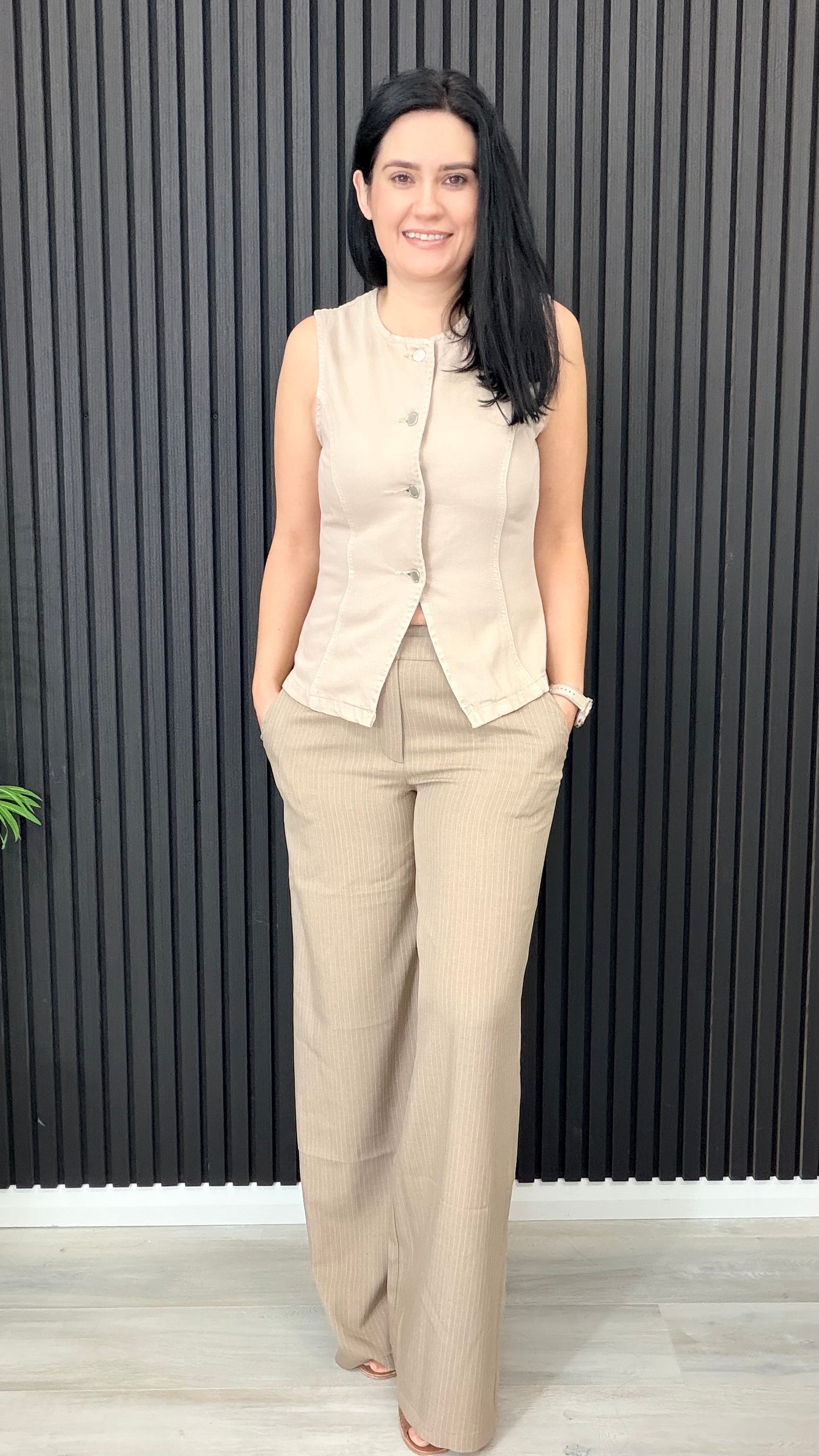 Beverly sleeveless waistcoat in neutral tone styled with trouser