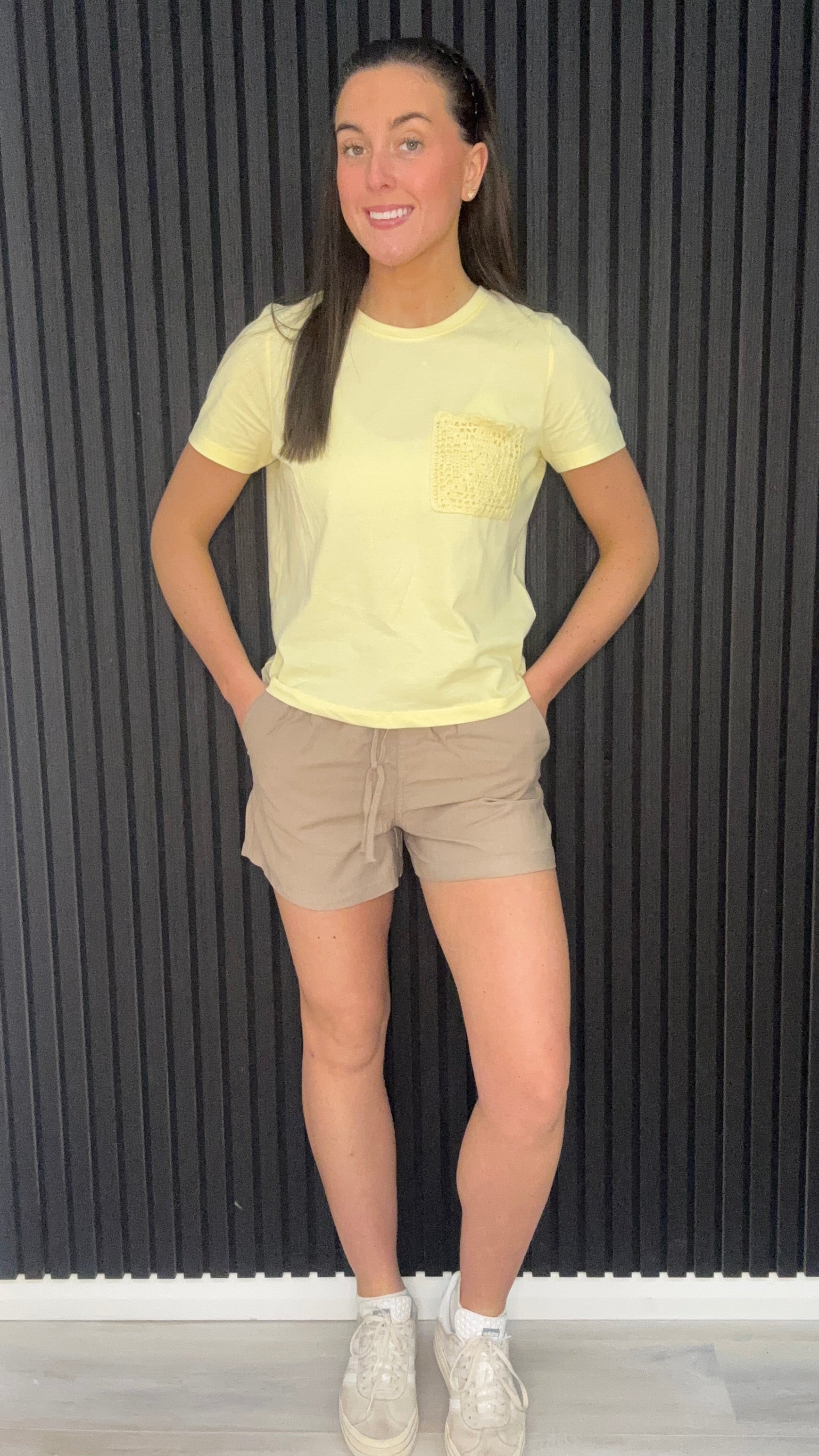 Laura taupe grey drawstring shorts styled with yellow crochet pocket t-shirt