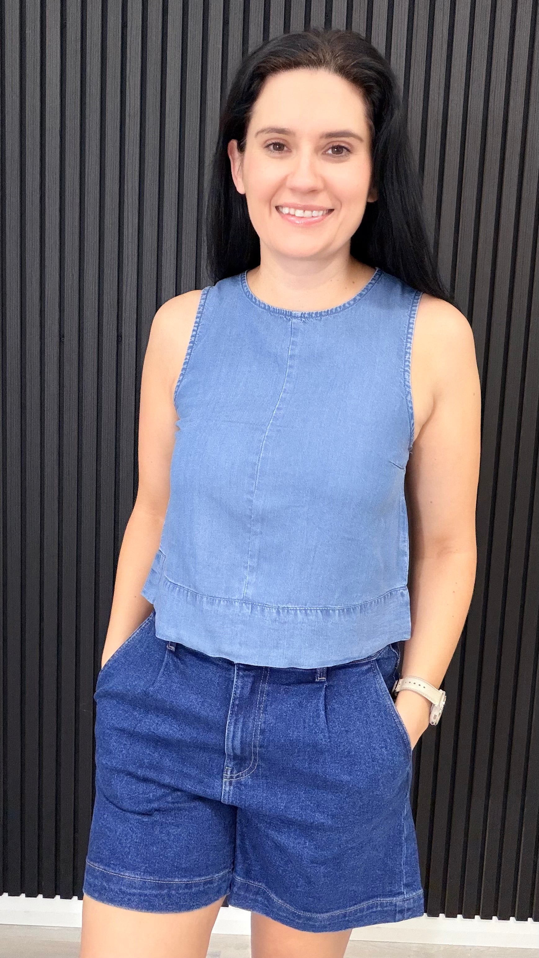 Charlene sleeveless lightweight denim top with peplum hem, styled with denim shorts