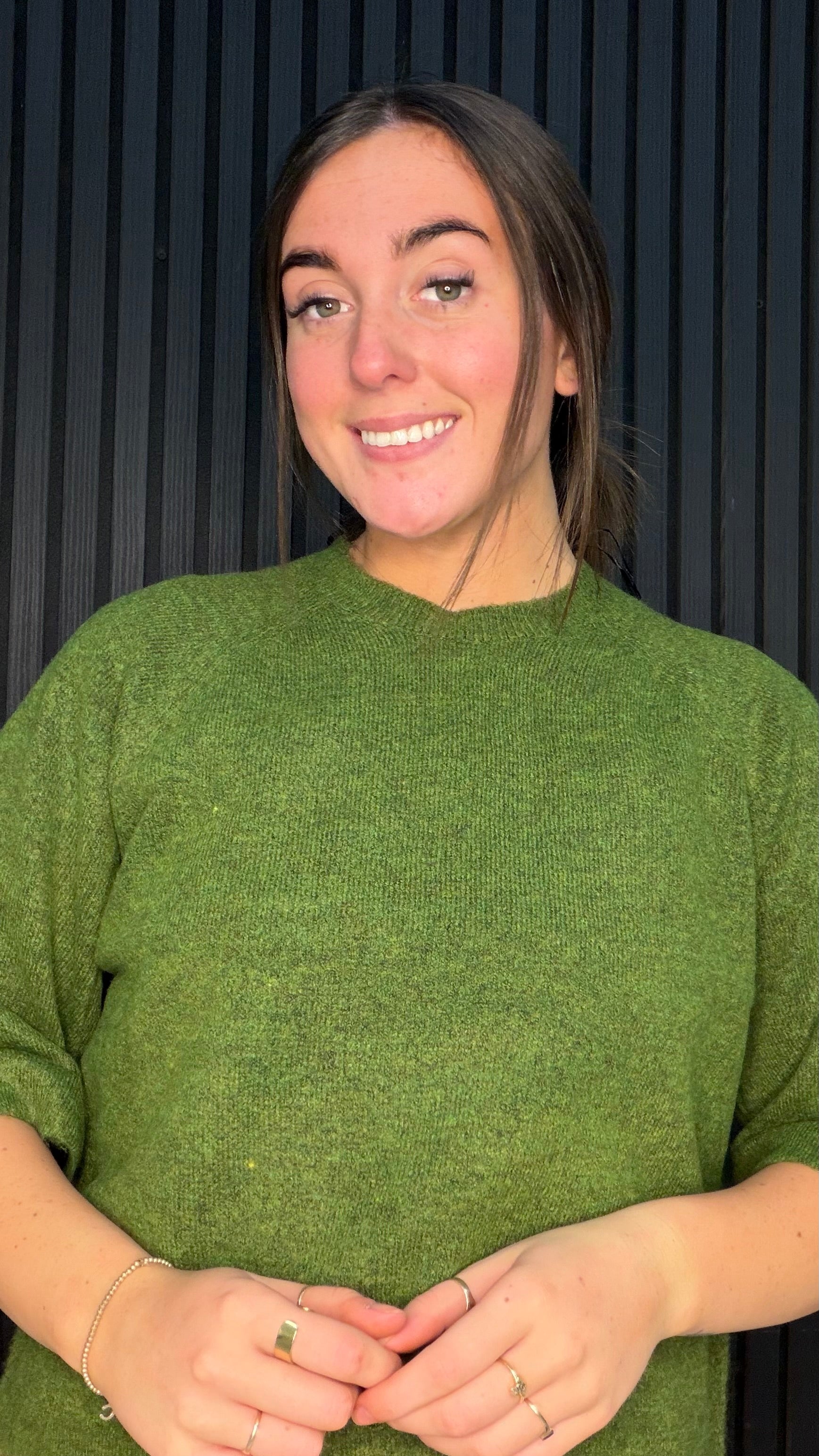 Woman wearing Simone Forest Green fine knit crew neck jumper.