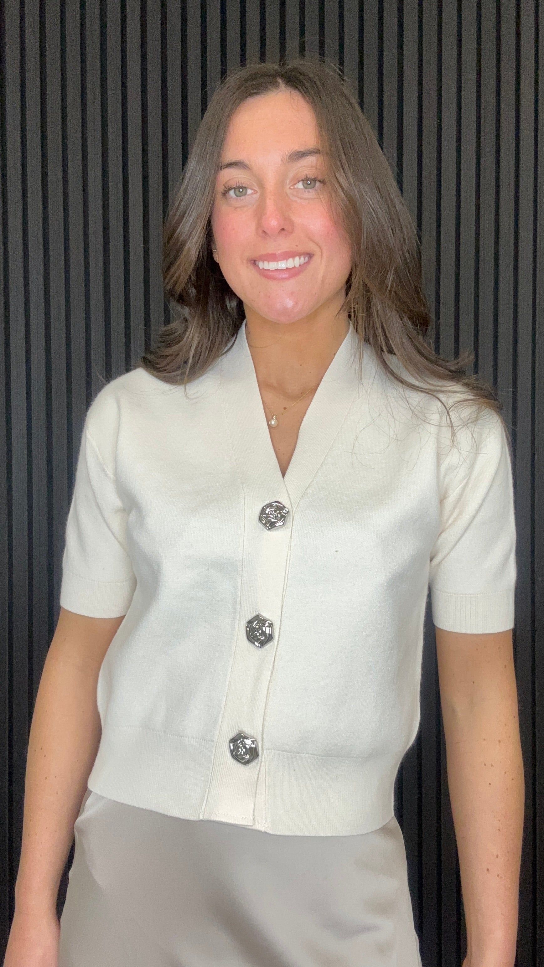 Tina Cardigan in soft cream — short sleeve knit cardigan with statement buttons front view