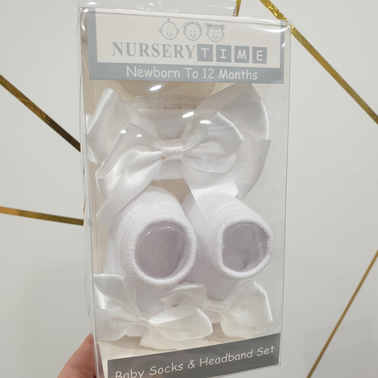 White baby socks and headband