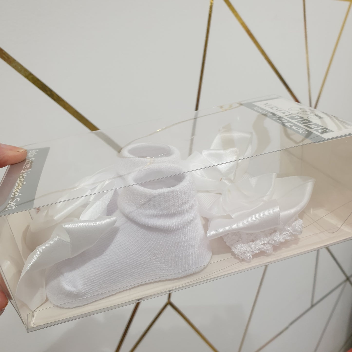 White baby socks and headband