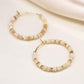 Seed pearl, bead and faux gold hoop and pebble earrings