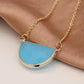 Golden and blue crystal half moon necklace