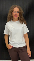 Bonnie Snow White T-shirt with statement tonal ruffle bow detail and short sleeves.