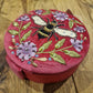 Rich pink velvet round jewellery and keepsake box with embroidered and embellished bee design