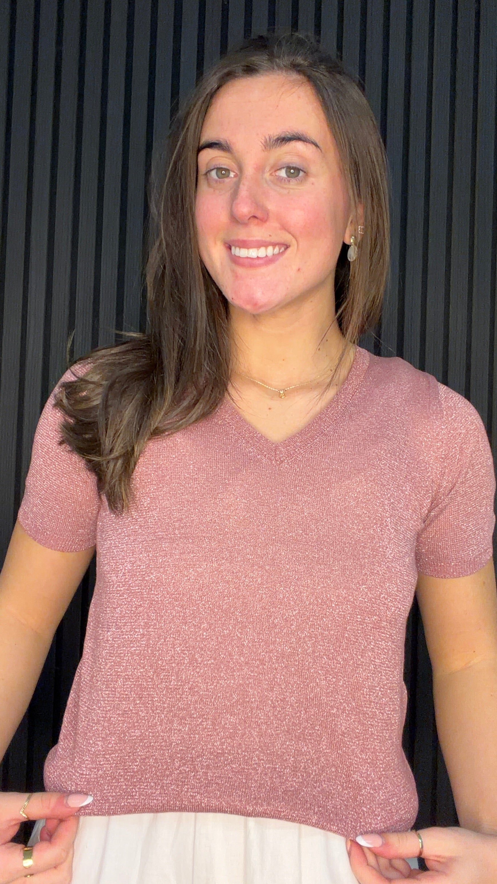 Model wearing the Brona Glitter Knit Top in Deco Rose with a V-neck and subtle shimmer finish.