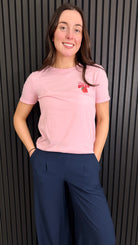 Front view of pink Strawberry Dream t-shirt with small chest graphic.