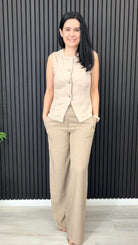 Beverly sleeveless waistcoat in neutral tone styled with trouser