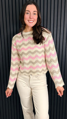 Front view of pastel zigzag knit jumper on model