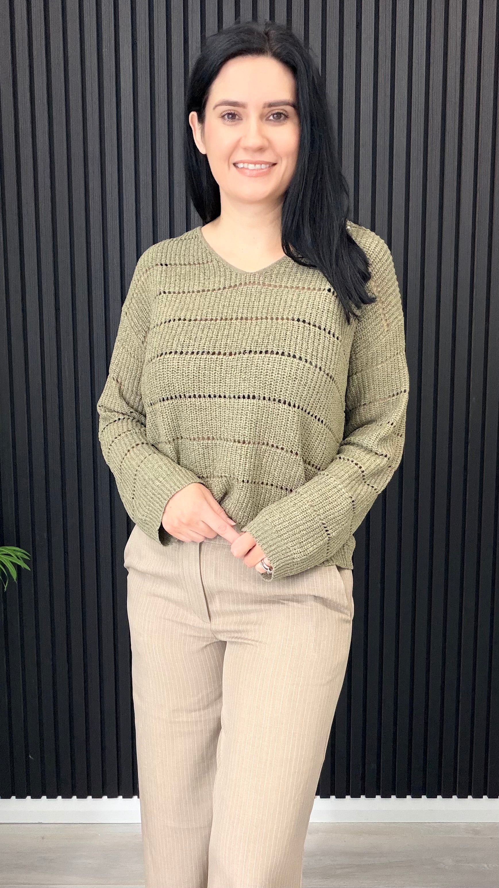 Pamela flat knit v-neck jumper styled with wide leg trousers