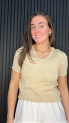 Model wearing the Bernie Gold Glitter Knit Top in Frosted Almond with a subtle shimmer finish.