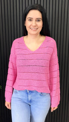 Pamela flat knit v-neck jumper in pink styled with denim