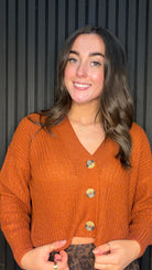 Model wearing the Carol Knitted Cardigan in Picante with a V-neck, button fastening and relaxed fit.