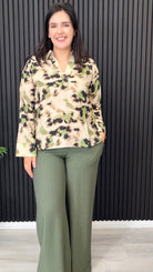 Millie abstract print long sleeve shirt styled with green wide leg trousers