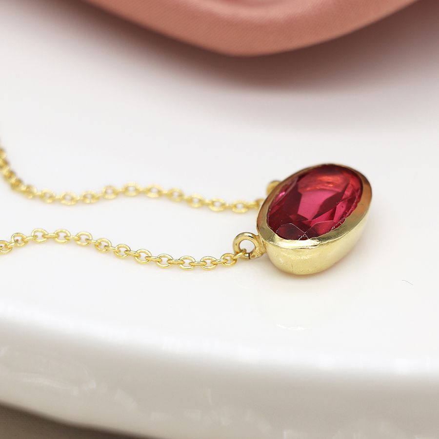 Gold plated simple ellipse necklace with pink glass