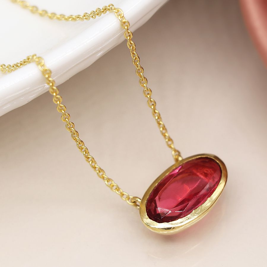 Gold plated simple ellipse necklace with pink glass