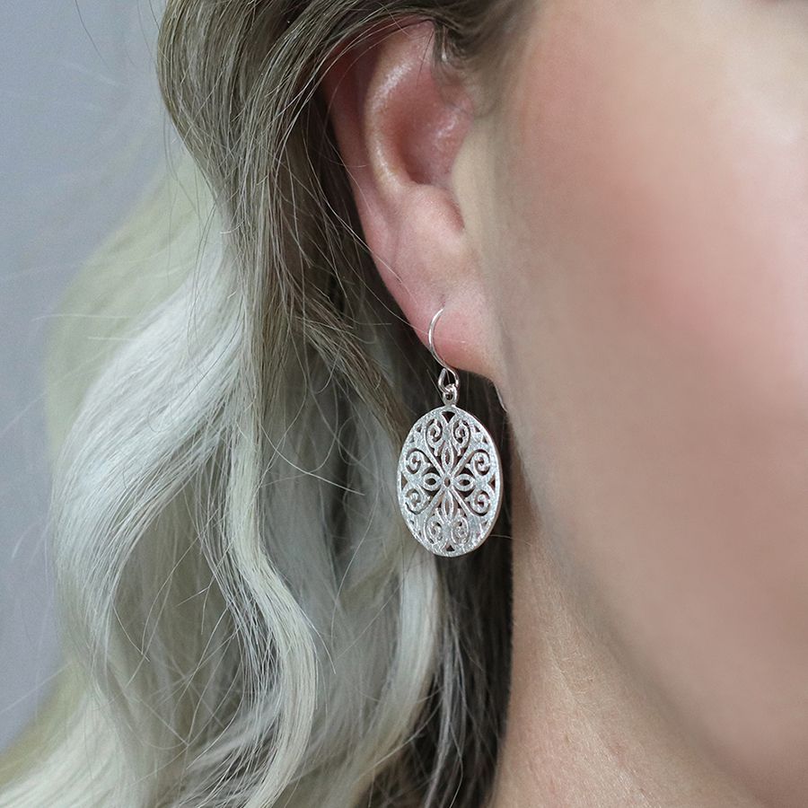 Sterling silver filigree disc drop earrings with scratched finish