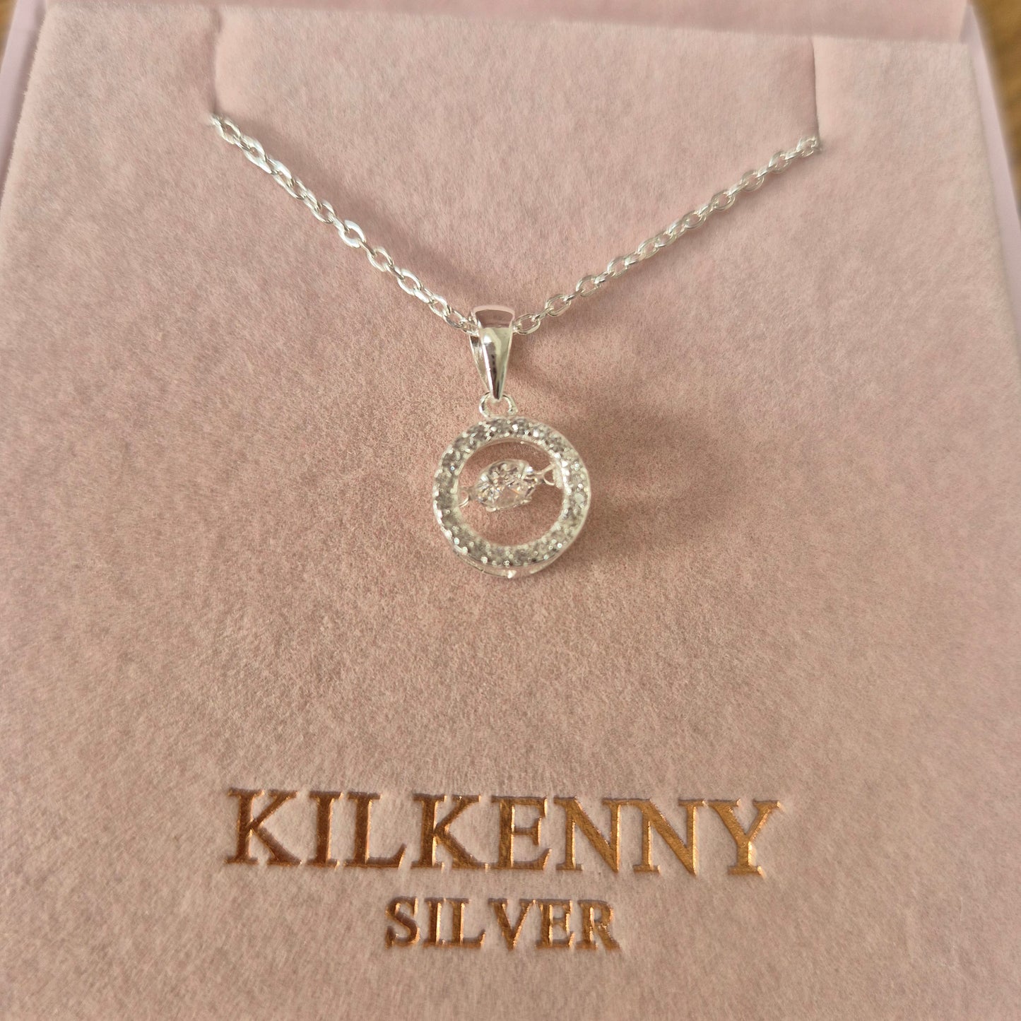 Silver necklace with rotating stone