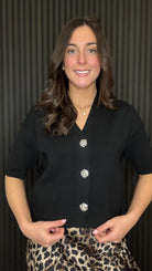 Black Tina cardigan with statement buttons styled with leopard print slip skirt